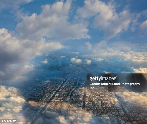 aerial view of cityscape under clouds - los angeles città foto e immagini stock