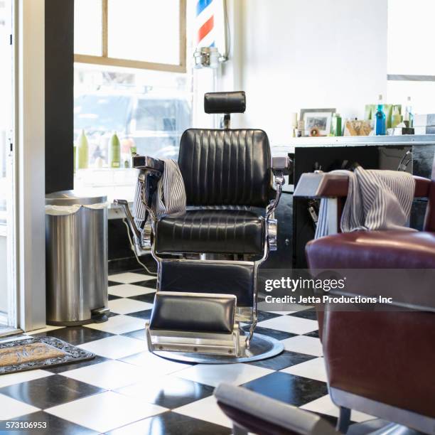 empty chairs in retro barbershop - 美容室　椅子 ストックフォトと画像