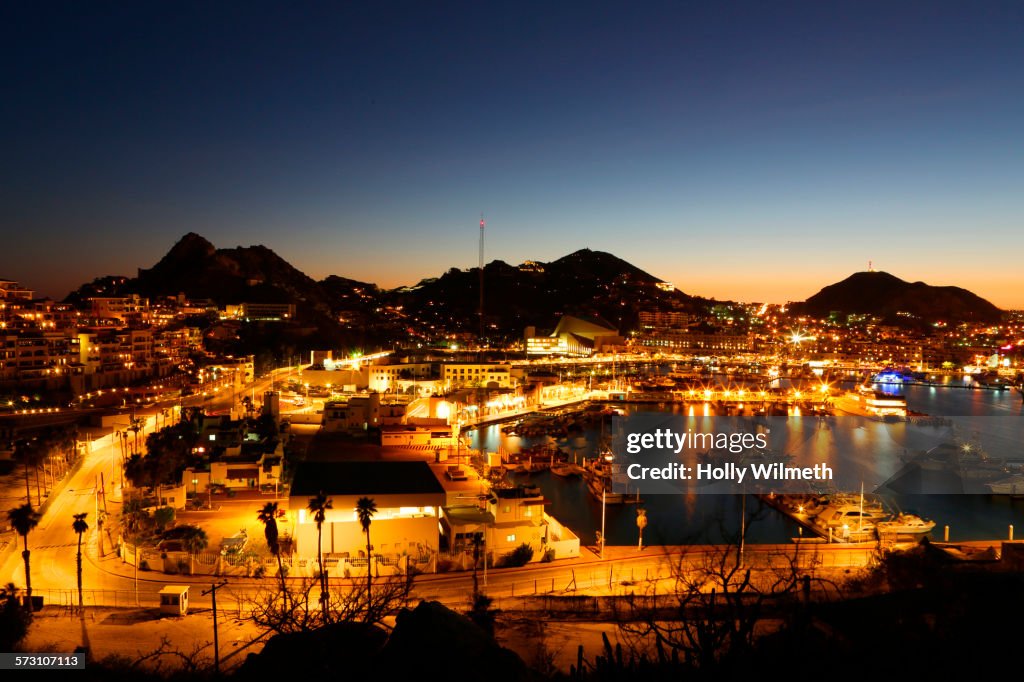 Illuminated Cabo San Lucas cityscape at sunset, Los Cabos, Mexico