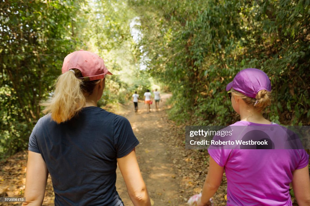 Women walking on remote dirt path