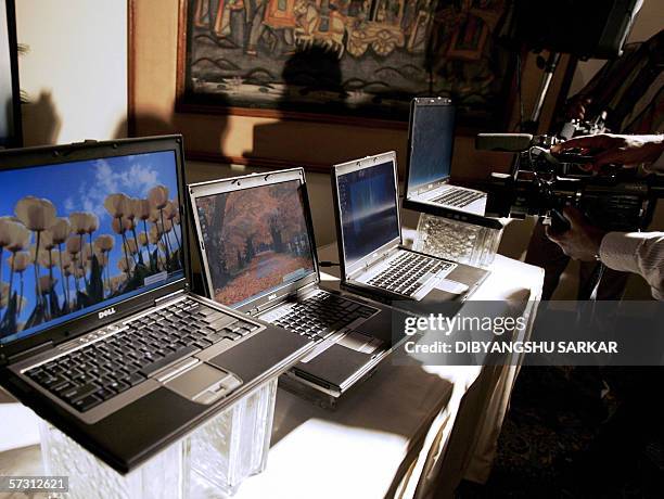 Cameraman of a private news channel takes a close shot of the newly launched Dell laptops during a press conference in Bangalore 11 April 2006. Dell...