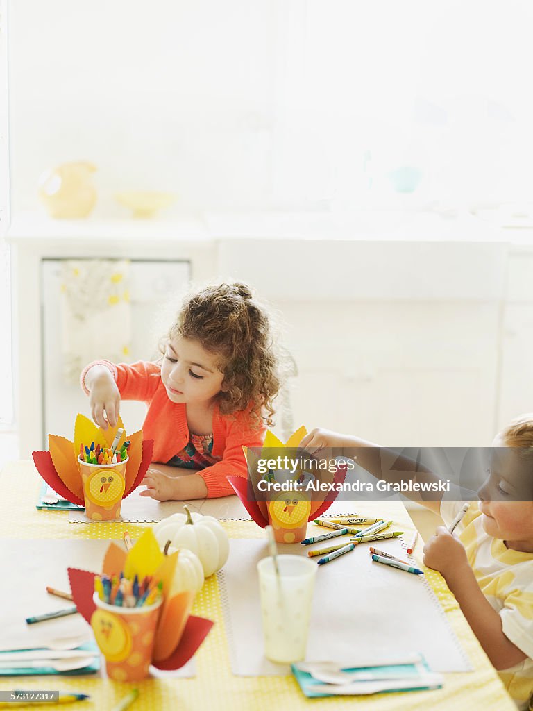 Children Drawing at Thanksgiving Table