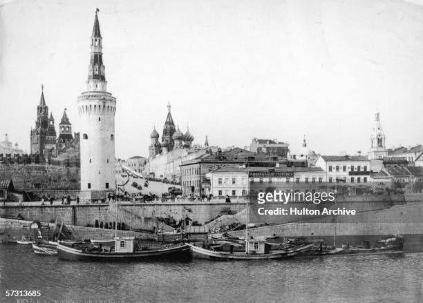 The city of Moscow on the River Moskva, circa 1900. Saint Basil's Cathedral and the Kremlin Towers are on the left.