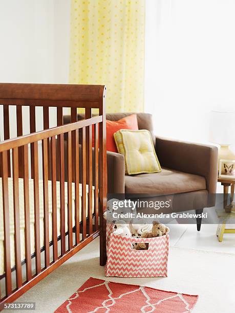 crib in nursery room - nursery bedroom stock pictures, royalty-free photos & images