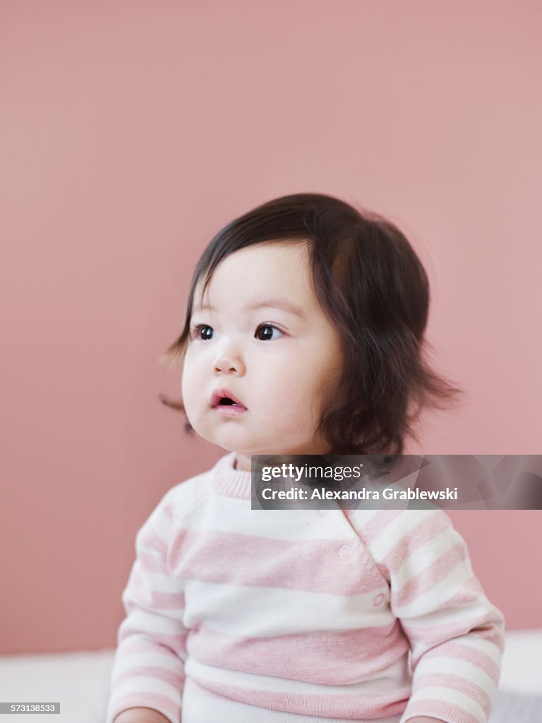 Seated Toddler Girl Gazing to the Side