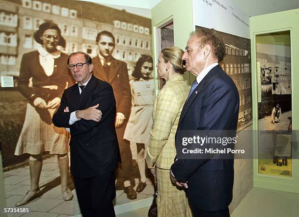 Visitors pause in front a photograph of Anne Frank (background after Dutch Princess Maxima attended the opening of a new exhibition of the letters of...