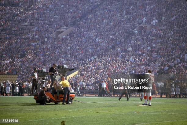 American professional football player Dave Hill of the Kansas City Chiefs is filmed by a CBS Television camera crew at Super Bowl One between the...