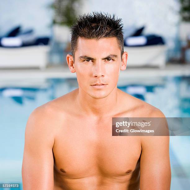 portrait of a young man looking serious - spiky hair stock-fotos und bilder