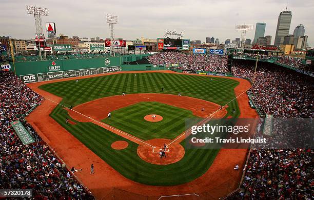 Pitcher Josh Beckett of the Boston Red Sox delivers the first pitch of the game against the Toronto Blue Jays during the Red Sox home opener on April...