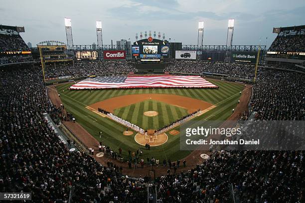 Giant U.S. Flag is unfurled during the National Anthem prior to the start of the Opening Day game between the Cleveland Indians and the Chicago White...