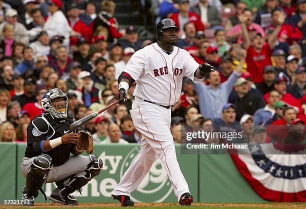 David Ortiz of the Boston Red Sox watches his home run in the seventh inning against the Toronto Blue Jays during the Red Sox home opener on April...