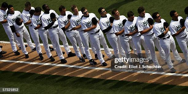 The Florida Marlins line up for the National Anthem before the start of their game against the San Diego Padres on April 11, 2006 at Dolphins Stadium...