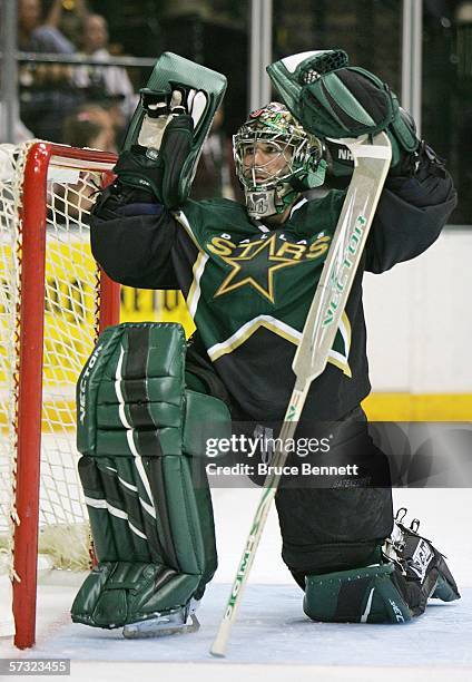 Marty Turco of the Dallas Stars waves to a fan during a timeout during the Stars 3-2 win over the Columbus Blue Jackets on April 11, 2006 at the...