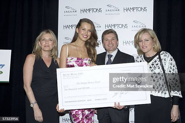 Debra Halpert, publisher of Hampton's Magazine, model Petra Nemcova, Gary Flom of Jaguar and Niche group publisher Laurie Burgess pose after...