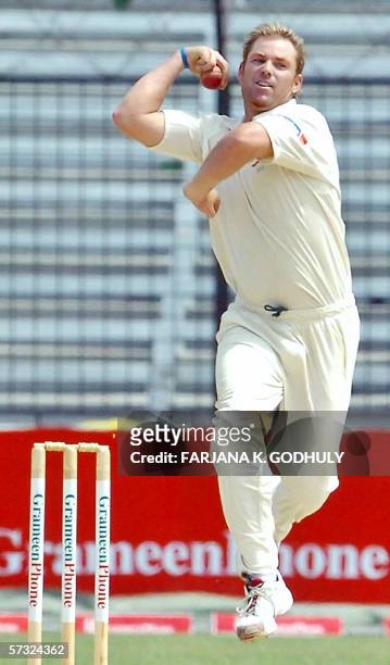 Narayanganj, BANGLADESH: Australian bowler Shane Warne delivers a ball during the fourth day of the first test match between Bangladesh and Australia...