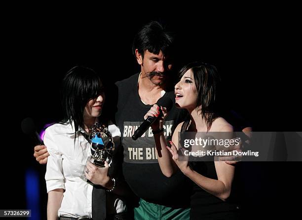 Television personality Matthew Johns, as his alterego Reg Reagan, presents the award for Spankin' New Aussie Artist to The Veronicas during the...