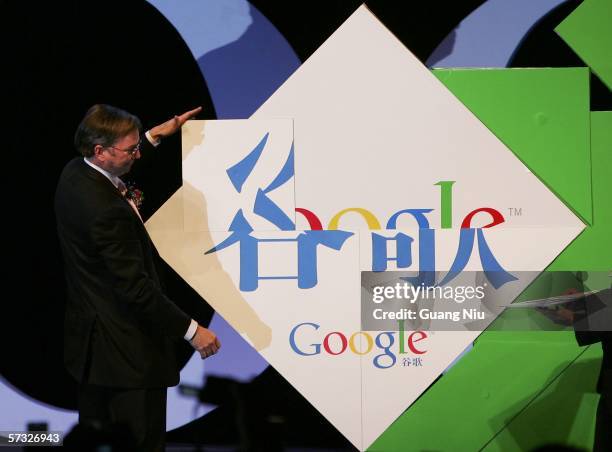 Google chief executive Eric Schmidt spells Chinese characters "Gu Ge" at the inauguration of the company new Chinese brand name April 12, 2006 in...