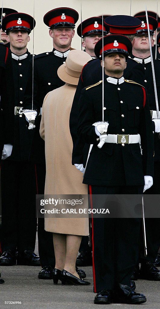 Britain's Prince Harry (2nd L) speaks wi