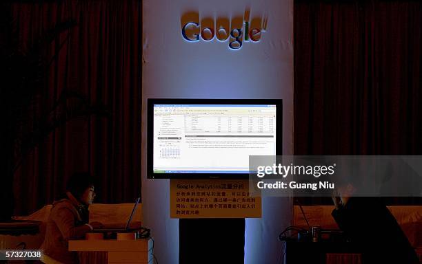 Visitors look at Google website in laptops during Google global Chinese name launch ceremony April 12, 2006 in Beijing, China. Google said it has...