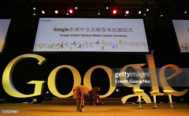 Workers clear a stage ahead Google global Chinese name launch ceremony April 12, 2006 in Beijing, China. Google said it has adopted the...