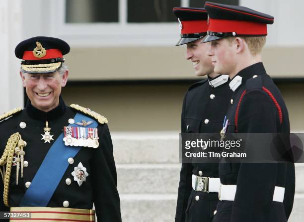 Prince Harry and Prince William stand on the steps of the Old College at Sandhurst Military Academy with their father Prince Charles, Prince of Wales...