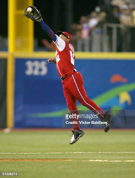 Michel Enriquez of Cuba fields against Puerto Rico on March 15, 2006 at Hiram Bithorn Stadium in San Juan, Puerto Rico. Cuba defeated Puerto Rico 4-3.