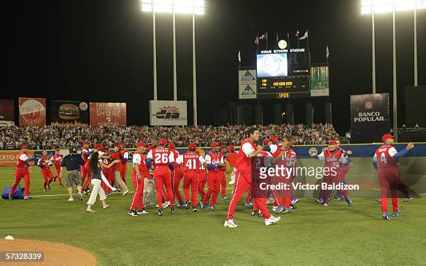 Members of Team Cuba celebrate after the game gainst Puerto Rico on March 15, 2006 at Hiram Bithorn Stadium in San Juan, Puerto Rico. Cuba defeated...