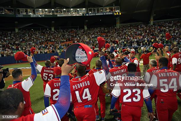 Members of Team Cuba celebrate after the game gainst Puerto Rico on March 15, 2006 at Hiram Bithorn Stadium in San Juan, Puerto Rico. Cuba defeated...