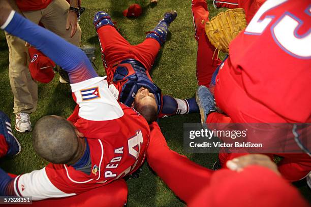 Members of Team Cuba celebrate after the game gainst Puerto Rico on March 15, 2006 at Hiram Bithorn Stadium in San Juan, Puerto Rico. Cuba defeated...