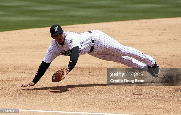 Third baseman Miguel Cabrera of the Florida Marlins makes a stop on a ball hit in the second inning against the San Diego Padres at Dolphin Stadium...