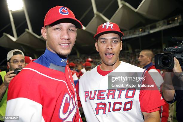 Yulieski Gourriel of Cuba is pictured with Jose Cruz Jr of Puerto Rico after the game on March 15, 2006 at Hiram Bithorn Stadium in San Juan, Puerto...