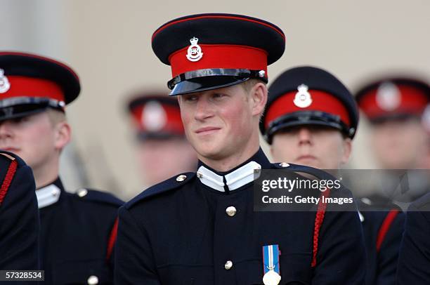 Prince Harry looks on at his passing-out Sovereign's Parade at Sandhurst Military Academy on April 12, 2006 in Sandhurst, England.