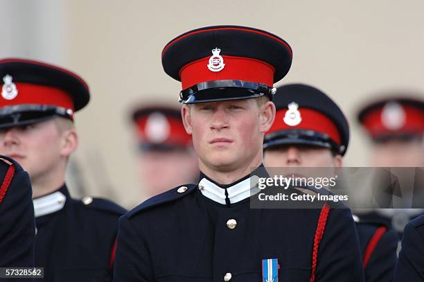 Prince Harry stands to attention at his passing-out Sovereign's Parade at Sandhurst Military Academy on April 12, 2006 in Sandhurst, England.