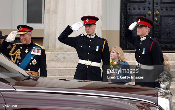 Prince Charles, Prince of Wales, Prince William and Prince Harry salute Queen Elizabeth II as she leaves the passing-out Sovereign's Parade at...