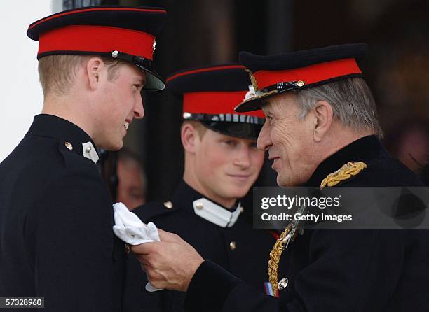 Prince William chats with General Sir Michael Jackson as Prince Harry looks on at the passing-out Sovereign's Parade at Sandhurst Military Academy on...