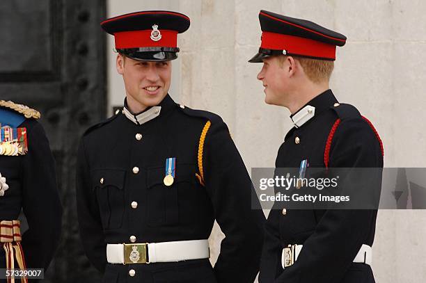 Prince William and Prince Harry looks on at the passing-out Sovereign's Parade at Sandhurst Military Academy on April 12, 2006 in Sandhurst, England.