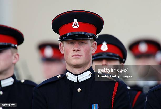 Prince Harry stands to attention at his passing-out Sovereign's Parade at Sandhurst Military Academy on April 12, 2006 in Sandhurst, England.