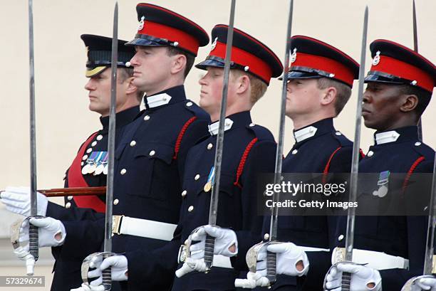 Prince Harry stands to attention at his passing-out Sovereign's Parade at Sandhurst Military Academy on April 12, 2006 in Sandhurst, England.