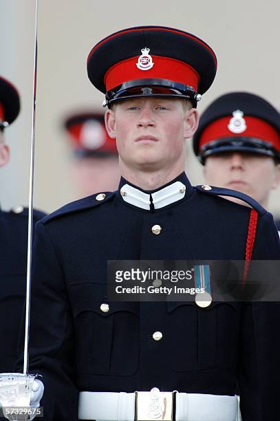 Prince Harry stands to attention at his passing-out Sovereign's Parade at Sandhurst Military Academy on April 12, 2006 in Sandhurst, England.