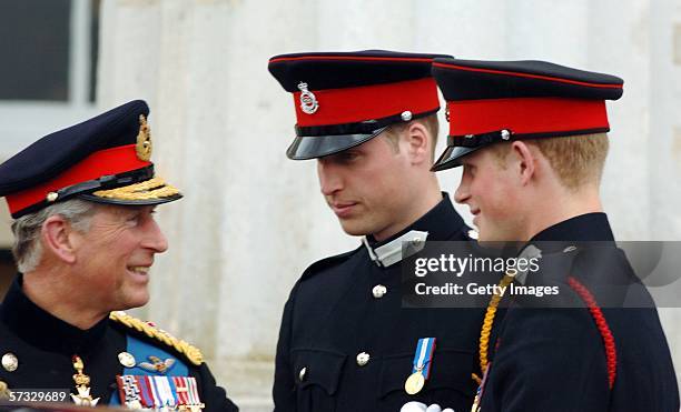 Prince Charles, Prince of Wales smiles with Prince William and Prince Harry at the passing-out Sovereign's Parade at Sandhurst Military Academy on...