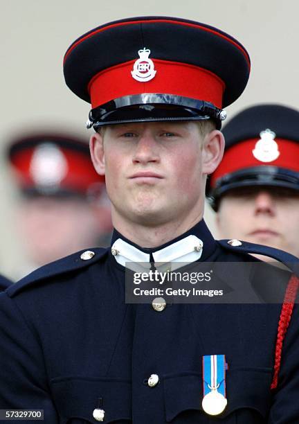 Prince Harry stands to attention at his passing-out Sovereign's Parade at Sandhurst Military Academy on April 12, 2006 in Sandhurst, England.