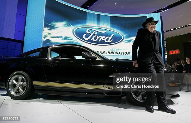 Legendary race car driver and designer Carroll Shelby poses with the 2007 Ford Shelby Mustang GT-H April 12, 2006 during the press preview of the...