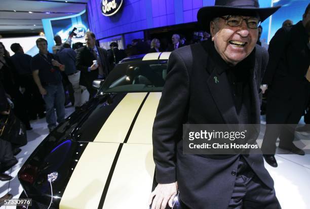 Legendary race car driver and designer Carroll Shelby poses with the 2007 Ford Shelby Mustang GT-H April 12, 2006 during the press preview of the...