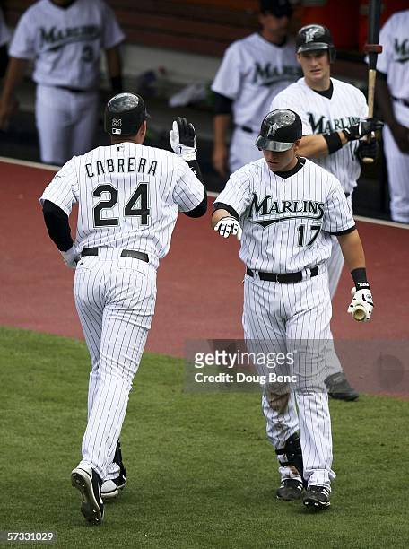 Third baseman Miguel Cabrera of the Florida Marlins is congratulated by Mike Jacobs after hitting a home run in the eighth inning against the San...