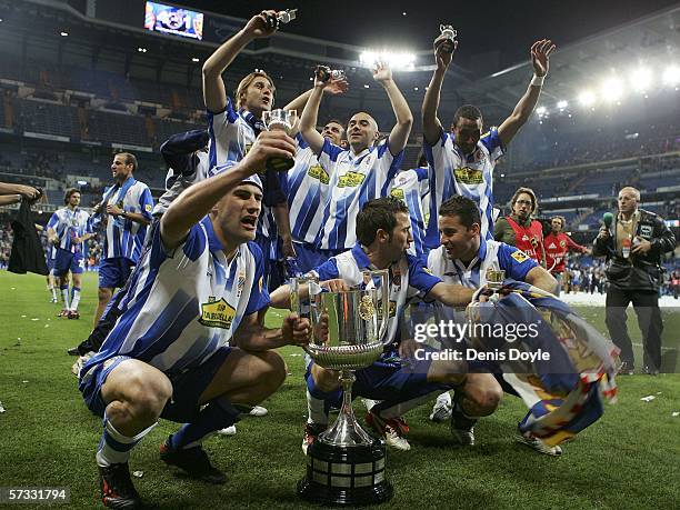 Espanyol players celebrate with the trophy after defeating Real Zaragoza 4-1 in the Kings Cup final at the Santiago Bernabeu Stadium on April 12,...