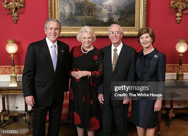 In this handout provided by The White House, U.S. President George W. Bush and First Lady Laura Bush welcome retired U.S. Supreme Court Justice...