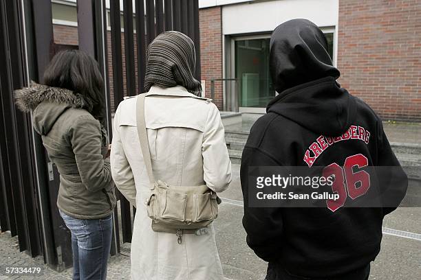 Arsu and Songol Surucu , sisters of Alpaslan and Mutlu Surucu, and a friend wait for their two brothers outside a Berlin courthouse after a court...