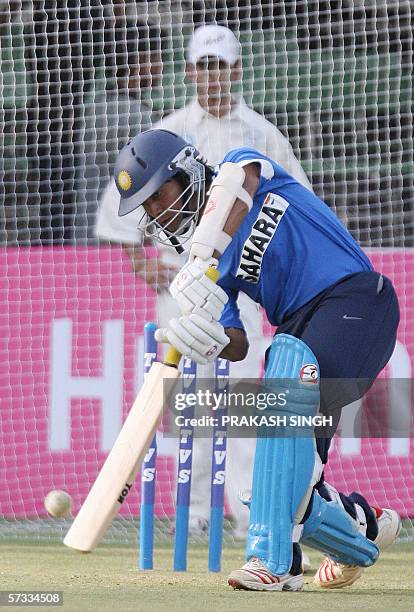Indian ricketer Dinesh Karthick hits a stroke during net practice at Usha Raje Cricket ground in Indore, 13 April 2006. India and England will play...