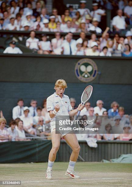 Boris Becker of Germany pumps his arms in the air during his defeat of Kevin Curren in the Men's Singles final of the Wimbledon Lawn Tennis...