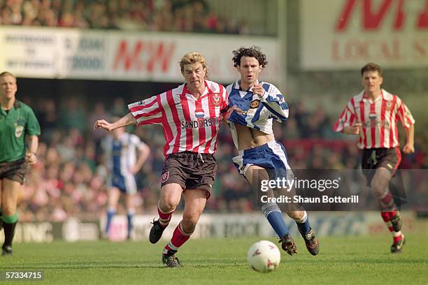 Barry Venison of Southampton challenges Ryan Giggs of Manchester United for the loose ball during the FA Carling Premiership match between...